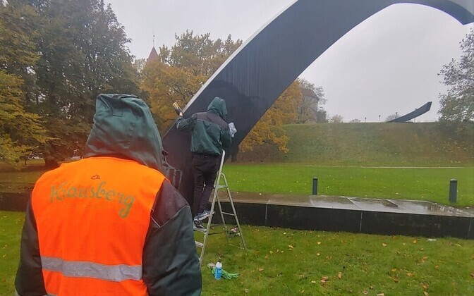 The graffiti being cleaned.