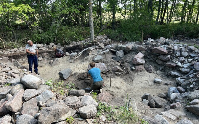Archeologists at the site of the Saastna chapel.
