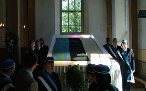 EÜS fraternity color guard with the historical blue, black and white flag at Otepää St. Mary's Lutheran Church in honor of the flag's 120th anniversary. June 4, 2004.