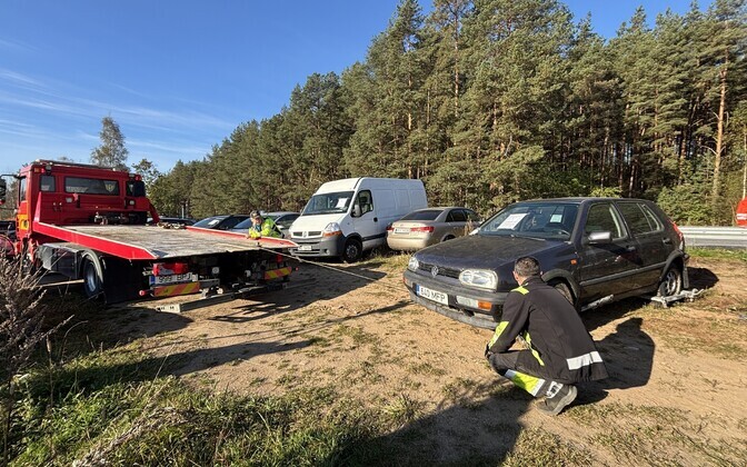 Abandoned vehicles at the Koidula border crossing parking lot.